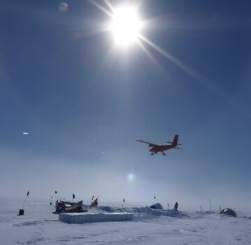 A airplane that is covered in snow