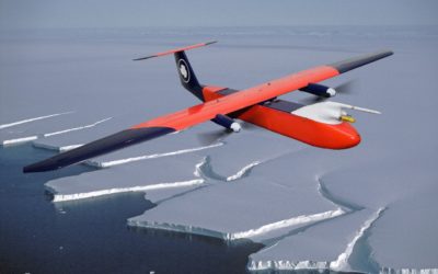 A plane flying over a body of water.