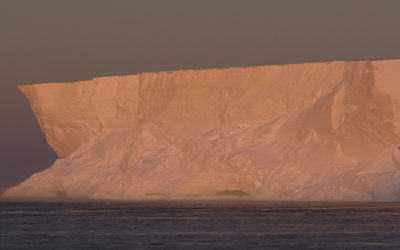 A close up of a snow covered mountain.
