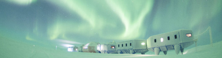 Winter image of the Halley VI Research Station on the Brunt Ice Shelf in Antarctica with aurora
