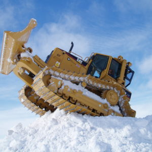 A tractor in the snow.