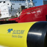 A close up of a gluder and ship.