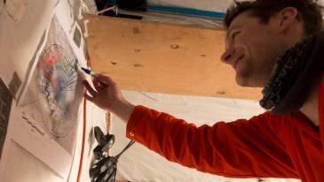 Tom Jordan checking his data on land (Ian Potten)