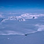 A close up of a snow covered mountain.