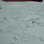 A close up of a snow covered mountain.