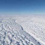 A close up of a snow covered slope.