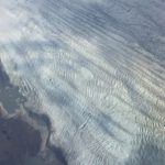 A close up of a snow covered mountain.