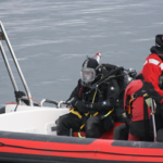 A group of people riding on the back of a boat