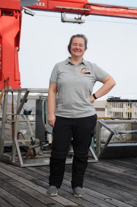 Katrin Linse standing in front of a boat