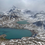An areal image of a snow covered mountain