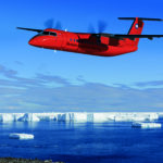 A plane flying over a body of water