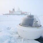 A boat that is sitting in the snow