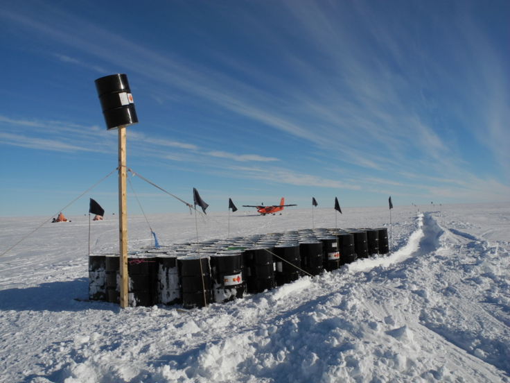 A group of people riding skis on top of a snow covered slope