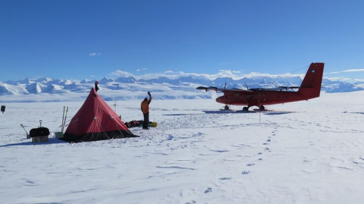 A airplane that is covered in snow