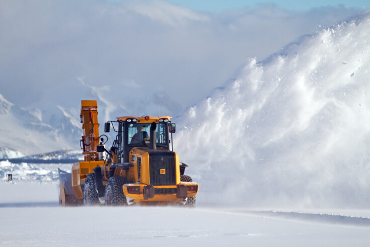 A man that is standing in the snow